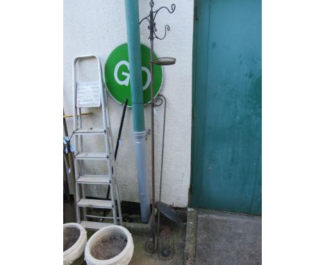 METAL BIRD FEEDER POLE WITH VARIOUS FEEDERS AND A SCROLLED WROUGHT METAL ITEM