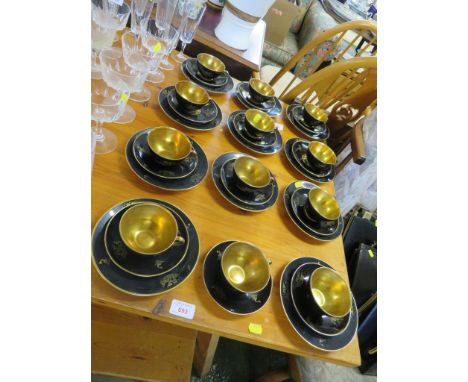 SWEDISH KARLSKRONA HALD PORCELAIN TWELVE CUPS AND SAUCERS, ELEVEN SIDE PLATES, BLACK AND GILT DECORATED WITH WOMAN AND SEAHOR