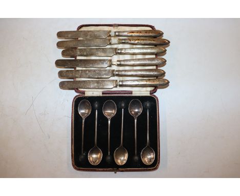 A cased set of six silver coffee spoons and six silver handled butter knives 