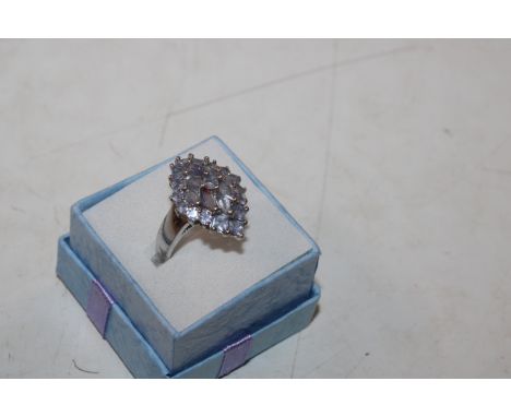 A sterling silver and tanzanite cluster dress ring, ring size P/Q