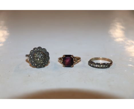 A 9 carat gold amethyst set ring, 2.2g, ring size L/M; a 9 carat gold silver marcasite set ring, ring size M/N; a gold filled
