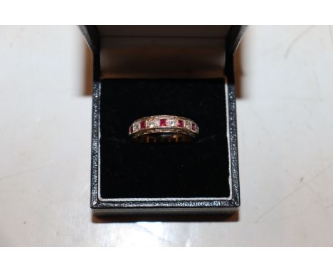 A vintage 9ct white and yellow gold ruby and white gem stone eternity ring, ring size D, approx. 3.5gms 