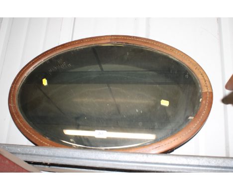 An Edwardian inlaid bevel edge wall mirror