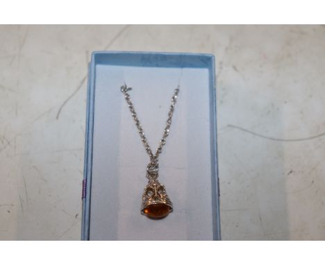 A vintage Sterling silver and amber seal necklace 