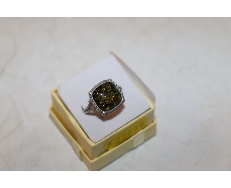 A Sterling silver and green amber set ring, ring size R/S