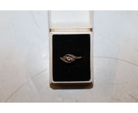 An 18 carat gold diamond set ring, ring size L/M, 2.5g total weight