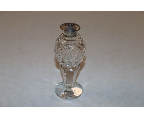 A cut glass sterling silver topped scent bottle, AF