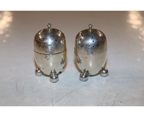 A pair of silver pepper pots, 55gms 