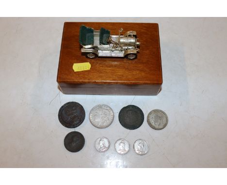 A trinket box containing 18th Century cartwheel penny, three 1887 silver sixpences, a 1921 dollar, a 1921 half crown etc.