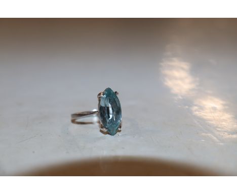 A French white metal ring set with aquamarine coloured stone, ring size O