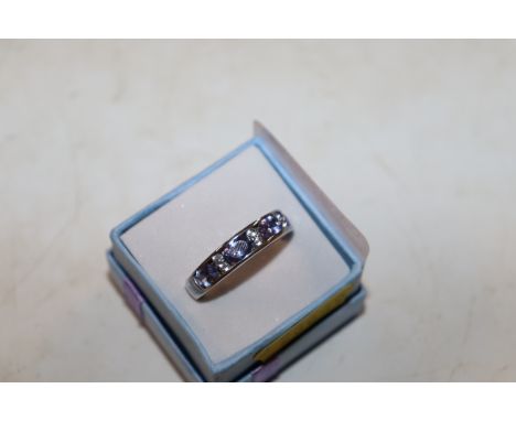 A Sterling silver tanzanite and white zircon set ring, ring size S/T
