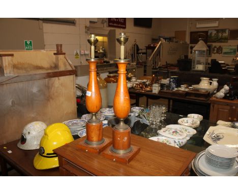 A pair of French wooden and brass mounted baluster table lamp bases and a pair of lamp shades
