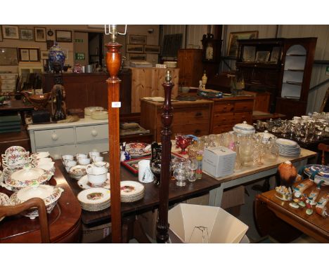 A walnut standard lamp and a mahogany standard lamp for rewiring, with shades