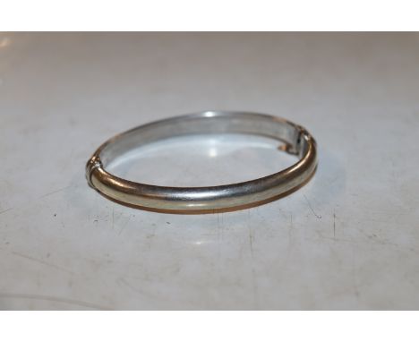 A vintage plain Sterling silver snap bangle 
