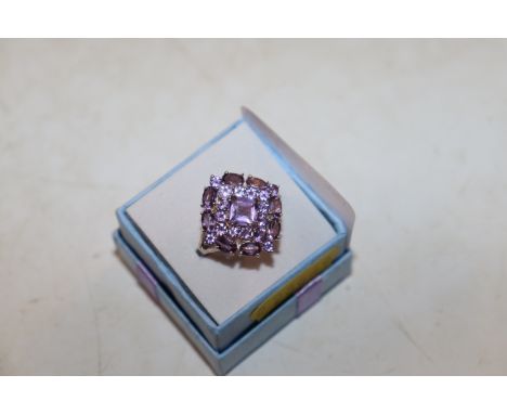 A large Sterling silver and amethyst set dress ring, rings size P/Q