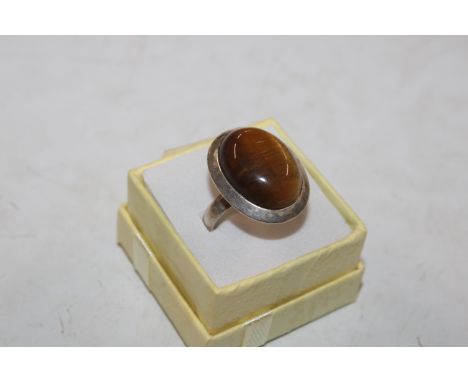 A large sterling silver and tigers eye set ring, ring size Q/R approx. 11gm