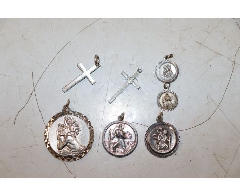 A collection of Vintage Sterling silver St Christophers and crosses, approx. total weight 25gms 
