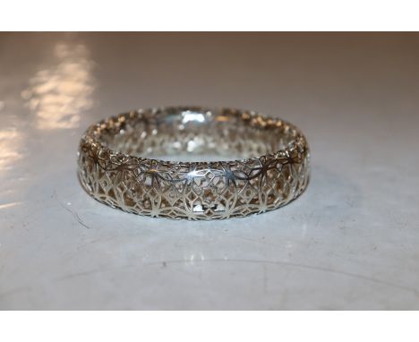 A white metal openwork full bangle, 40gms 