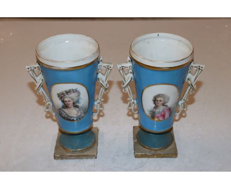 A pair of twin handled vases decorated with portrait panels initialled L.D., both restored