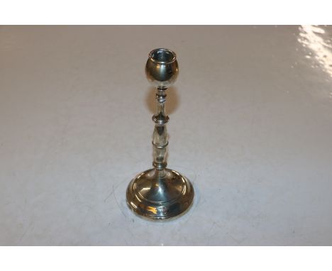 A silver candlestick 24.5cms high having weighted base total weight 411gm