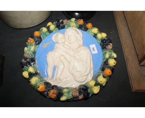 A vintage Italian ceramic glazed plaque depicting the Madonna and child AF