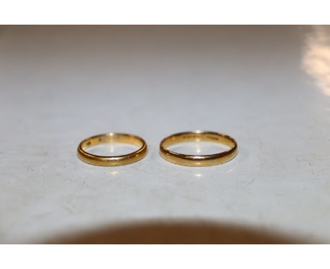 A 22 carat gold wedding band, ring size U and another 22 carat gold wedding band, ring size O/P.&nbsp; Approximate total weig