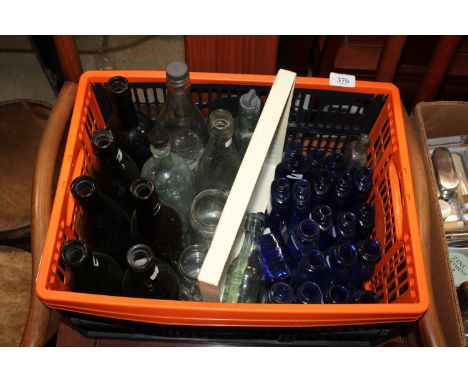 A collection of vintage glass medicine and other bottles
