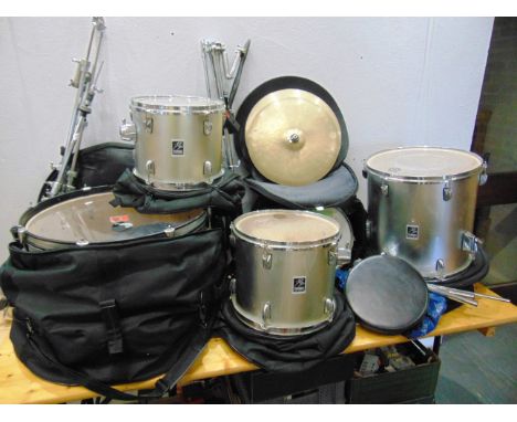 A PERFORMANCE PERCUSSION FIVE-PIECE DRUM KIT with stands, mutes and cymbals, the drums in Gear4Music soft cases.