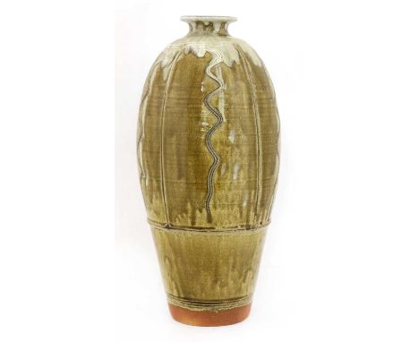 *Jim Malone (b.1946),a large stoneware combed and panelled vase, with a trailing mushroom glaze on an olive ground, impressed