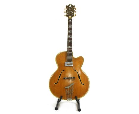 A 1954 Hofner Committee archtop acoustic guitar,serial number 2***, of single cutaway form in a natural finish with a Hofner 