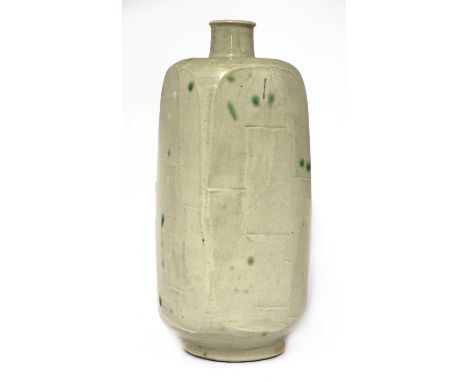 *William Marshall (1923-2007), a facet bottle vase, in a light celadon glaze with cut sides with green spots, impressed artis