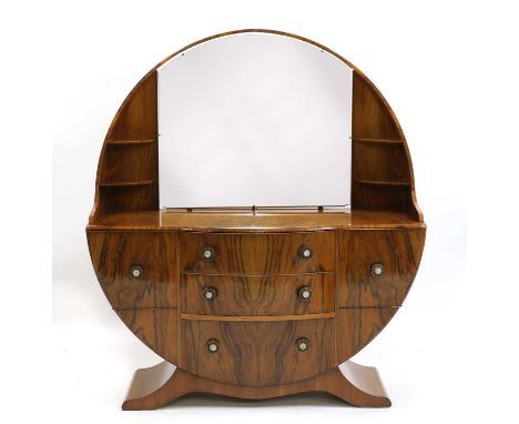 An Art Deco-style walnut veneered dressing table,with an arched top enclosing an easel mirror, with an arrangement of drawers