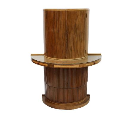 An Art Deco walnut and bird's-eye maple cocktail cabinet,probably by Epstein, of semicircular form, the top opening to reveal