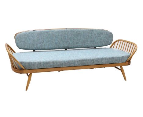 An Ercol light elm studio settee/daybed,mid-20th century, with spindle supports to either end and a low raised back,206cm wid