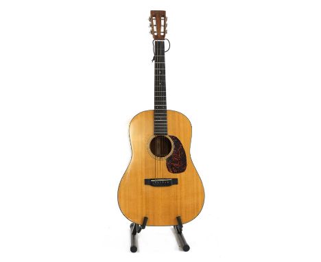 A Martin Vintage Series D-18VS acoustic guitar,serial number 11****7, of typical dreadnought form in a natural finish with a 