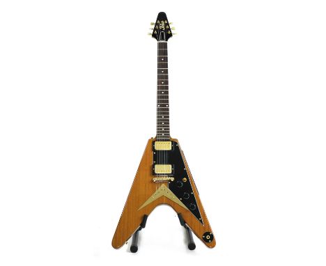 A 1984 Tokai Korina Flying V electric guitar, serial number 30****2, of conventional 'V' form with the Korina body in a varni