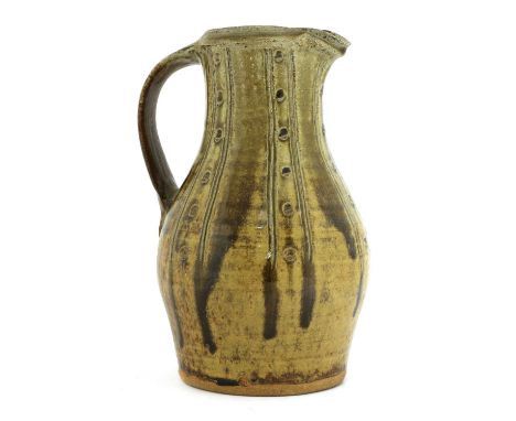 *Jim Malone (b.1946),a stoneware jug, with spot and line decoration, with a trailing brown glaze, impressed artist's monogram