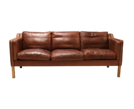 A Danish brown leather three-seater settee,with light beech supports, 201cm wide85cm deep75cm high, seat 47cm highCondition r