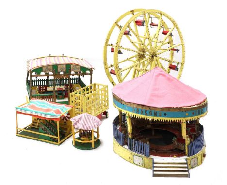 A scratch-built model fairground,20th century, consisting of a large Ferris wheel, a dragon ride, a cakewalk, shooting range 