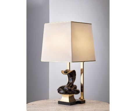 A Tommaso Barbi table lamp,c.1975, with an enamelled ceramic and brass base, 40cm wide82.5cm high Condition report: The base 