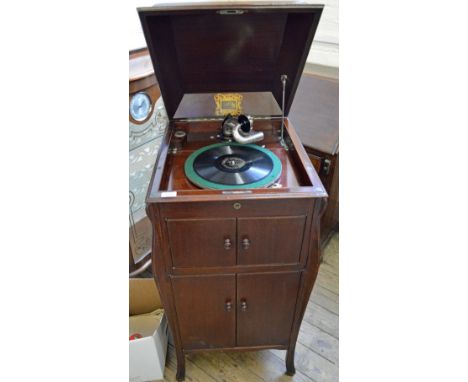 A 1926 Mahogany HMV record player and a quantity of 78 records