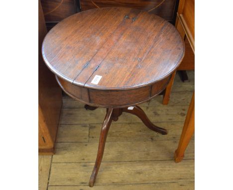 A small tripod drum sewing table