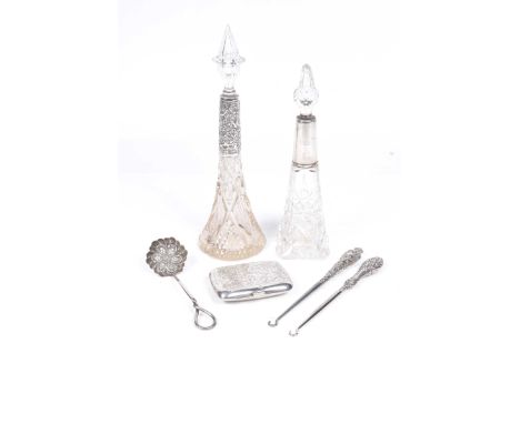 A mixed collection of early 20th Century silver items.To include two cut glass perfume bolltles and stoppers, each with a sil