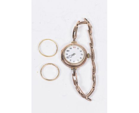 A 9k gold bandTogether with, a yellow metal band and an early 20th century 9k rose gold manual wind bracelet watch, weight of