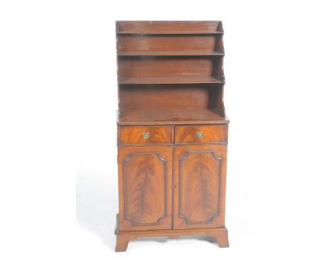 A reproduction Regency style mahogany chiffonierThe raised back with three graduated shelves above two frieze drawers and two