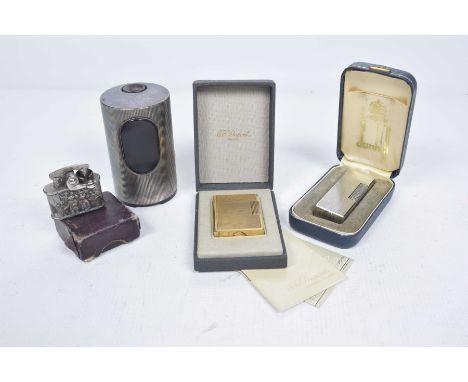 A collection of vintage lightersTo include a Dunhill engine turned chromed lighter, with original case, a vintage German Brau