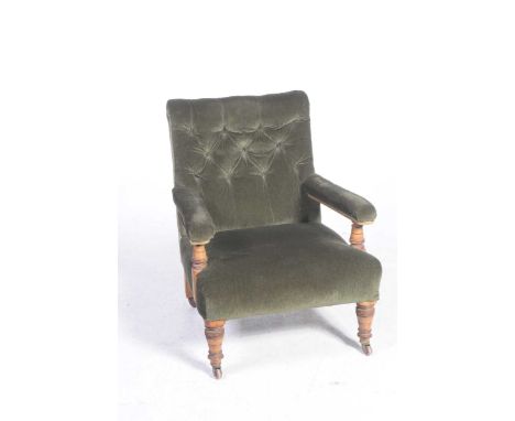 A Victorian oak and upholstered open armchairThe chair with a velour button back above padded arms raised on ringed turned up