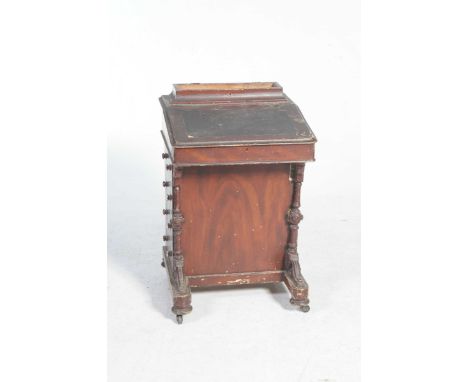 A rare Victorian stained pine DavenportHaving four drawers with button handles apposed by four faux drawers also applied with