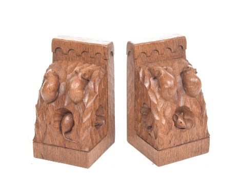 An unusual pair of Robert 'Mouseman' Thompson oak triple mouse book ends Of typical 'L' shape carved with naturalistic curved