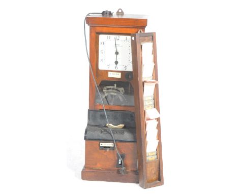 An early 20th Century National time recorder Co limited clocking in clock Having a walnut case and 20cm square white dial wit